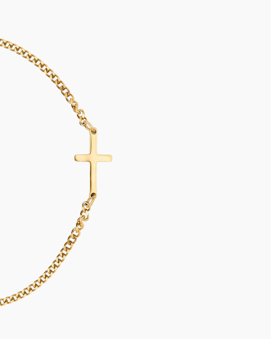 Gold cross bracelet details image