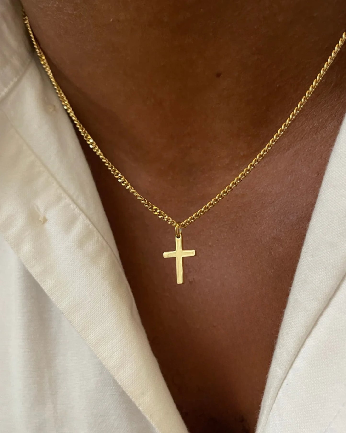 Gold cross chain on model image