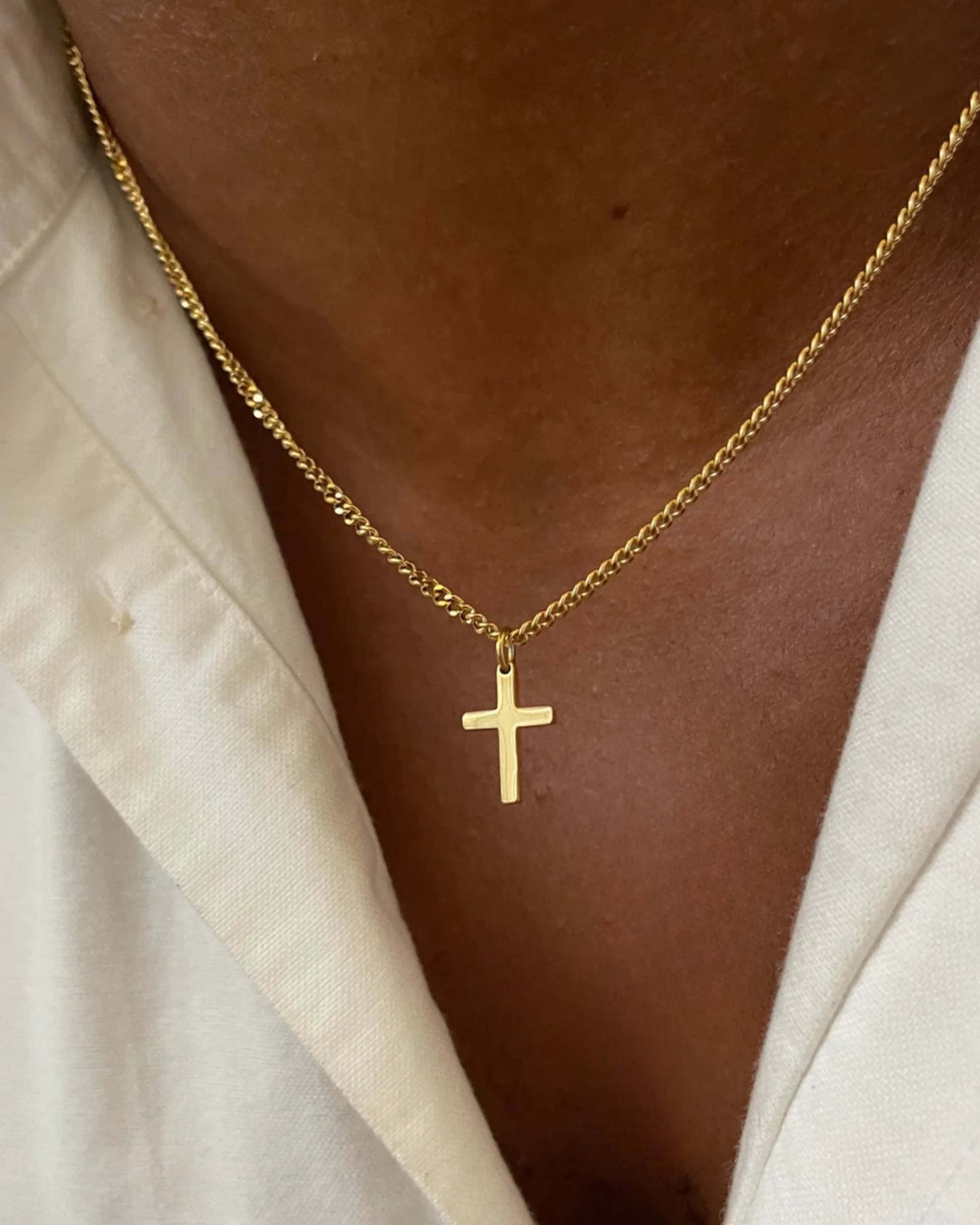 Gold cross chain on model image