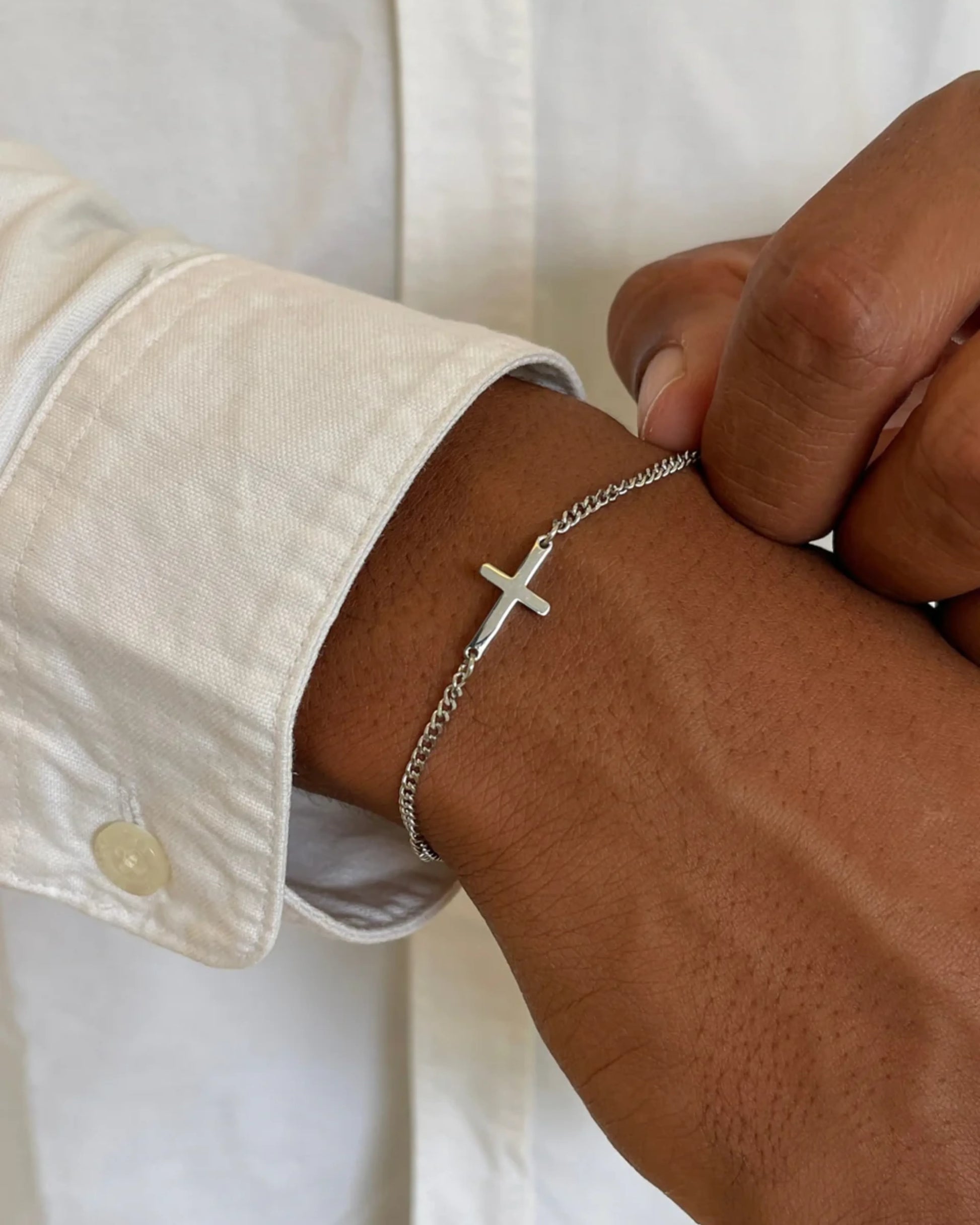 Silver cross bracelet on model image