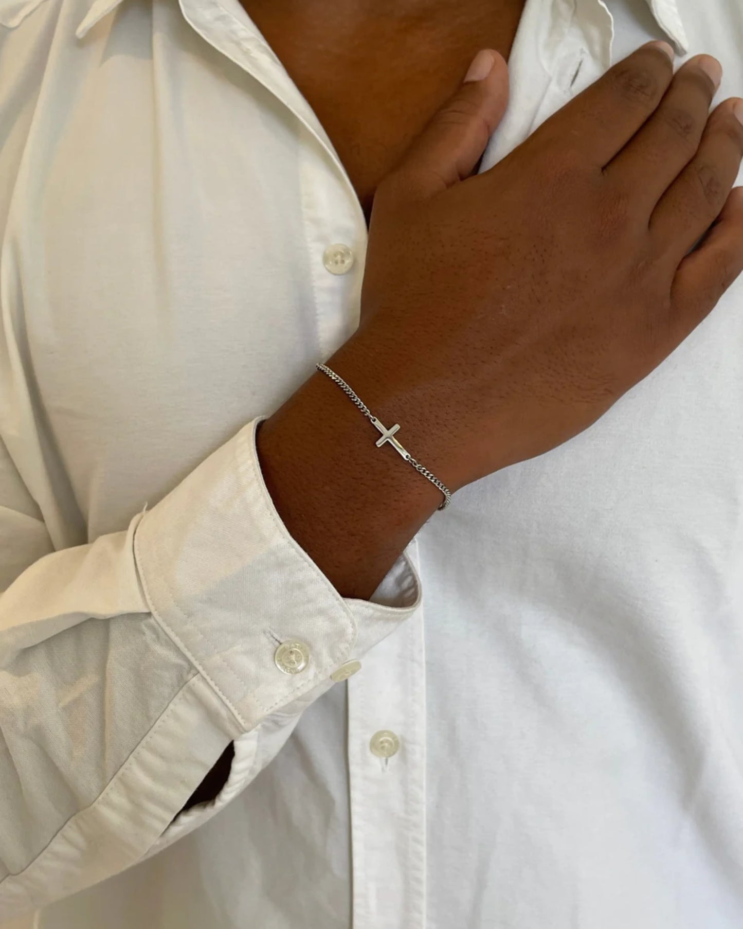 Silver cross bracelet on model image