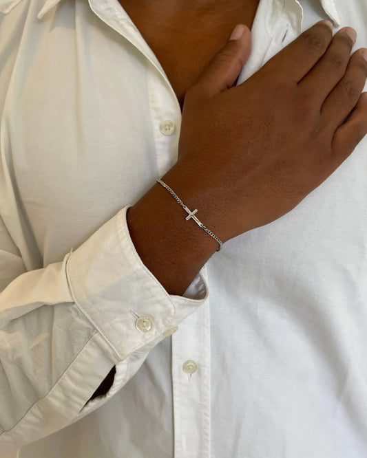 Silver cross bracelet on model image