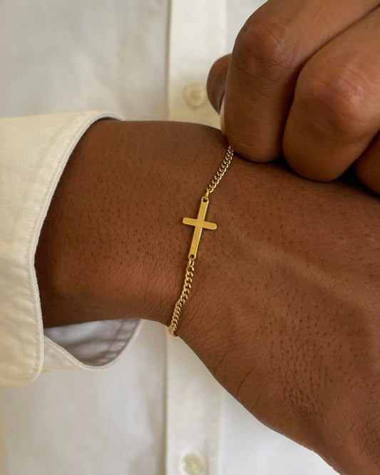 Gold cross bracelet on model image