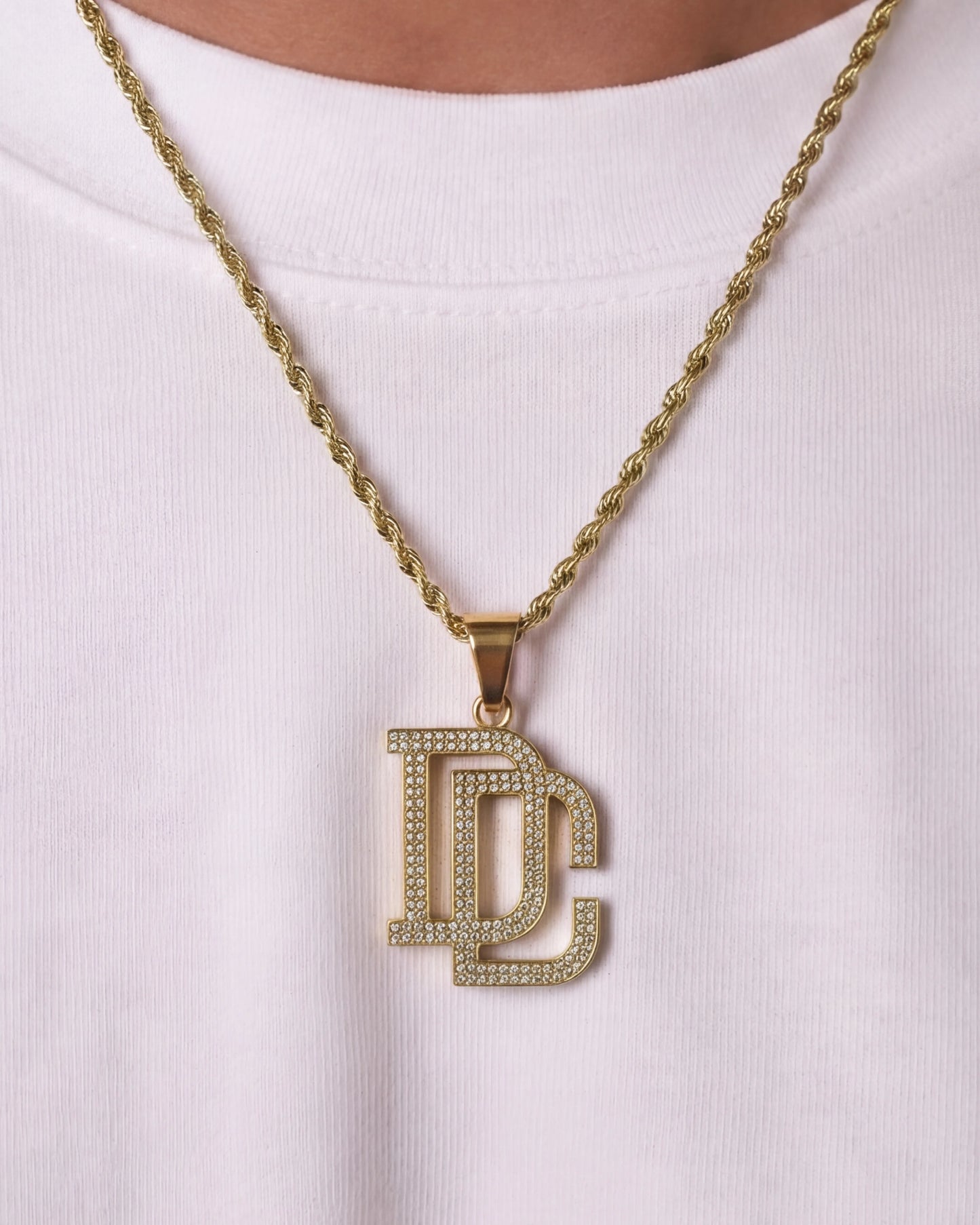 DC chain gold necklace close up on model photo