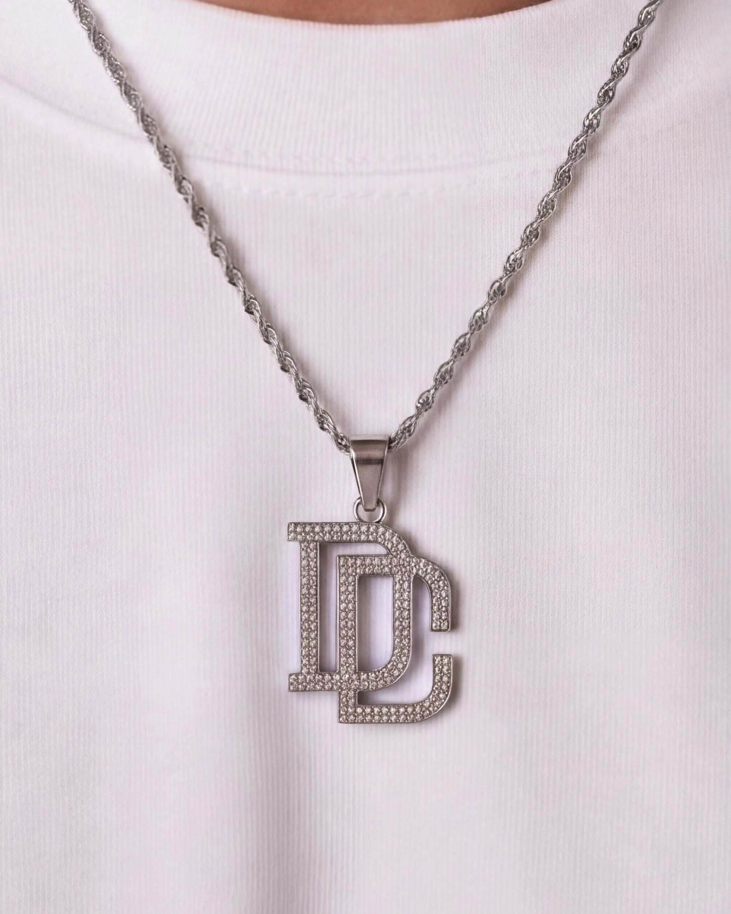 DC chain silver necklace close up on model photo