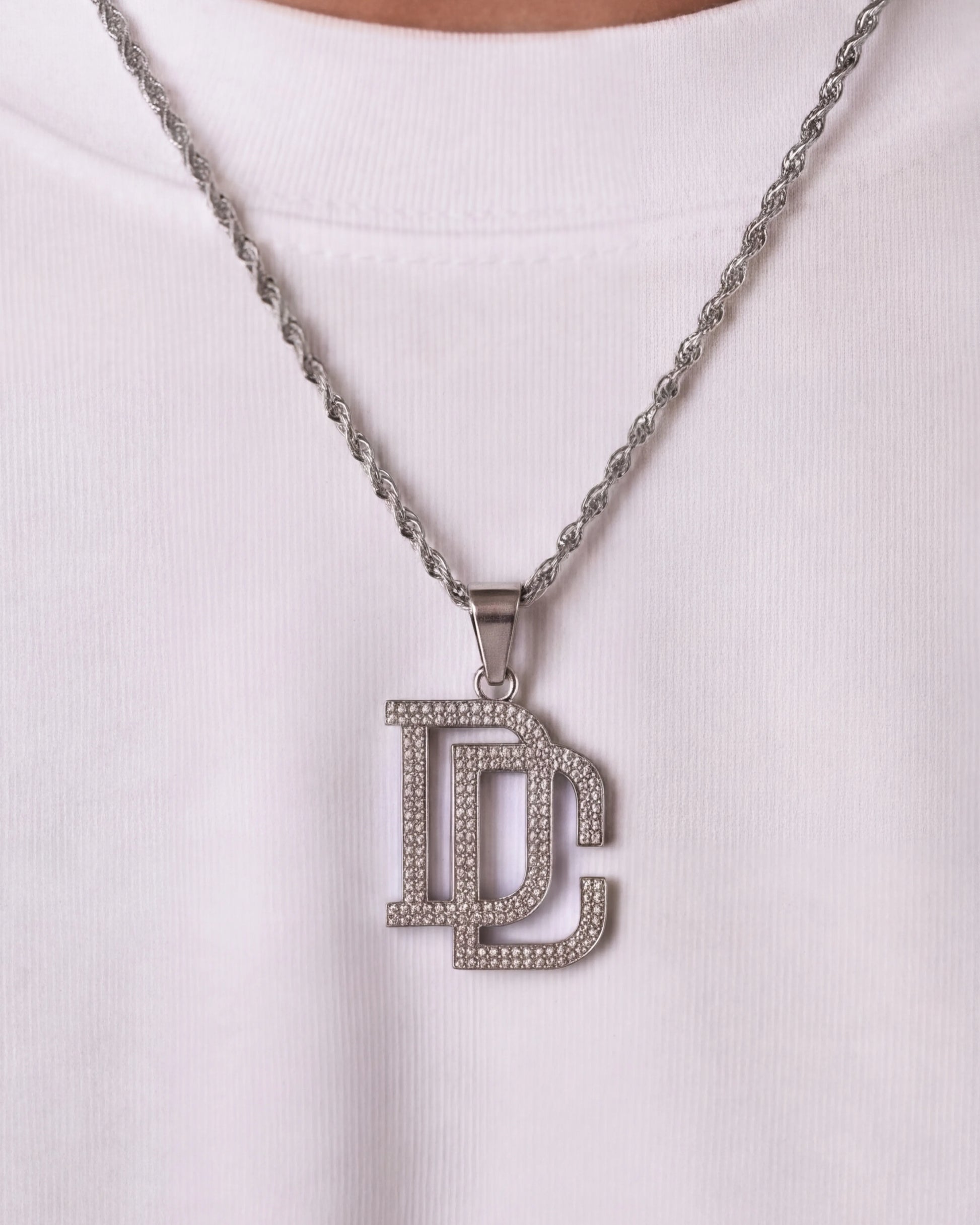 DC chain silver necklace close up on model photo