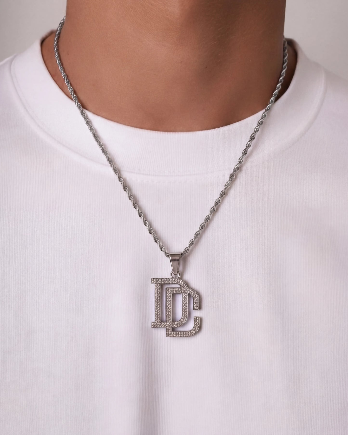 DC chain silver necklace on model photo