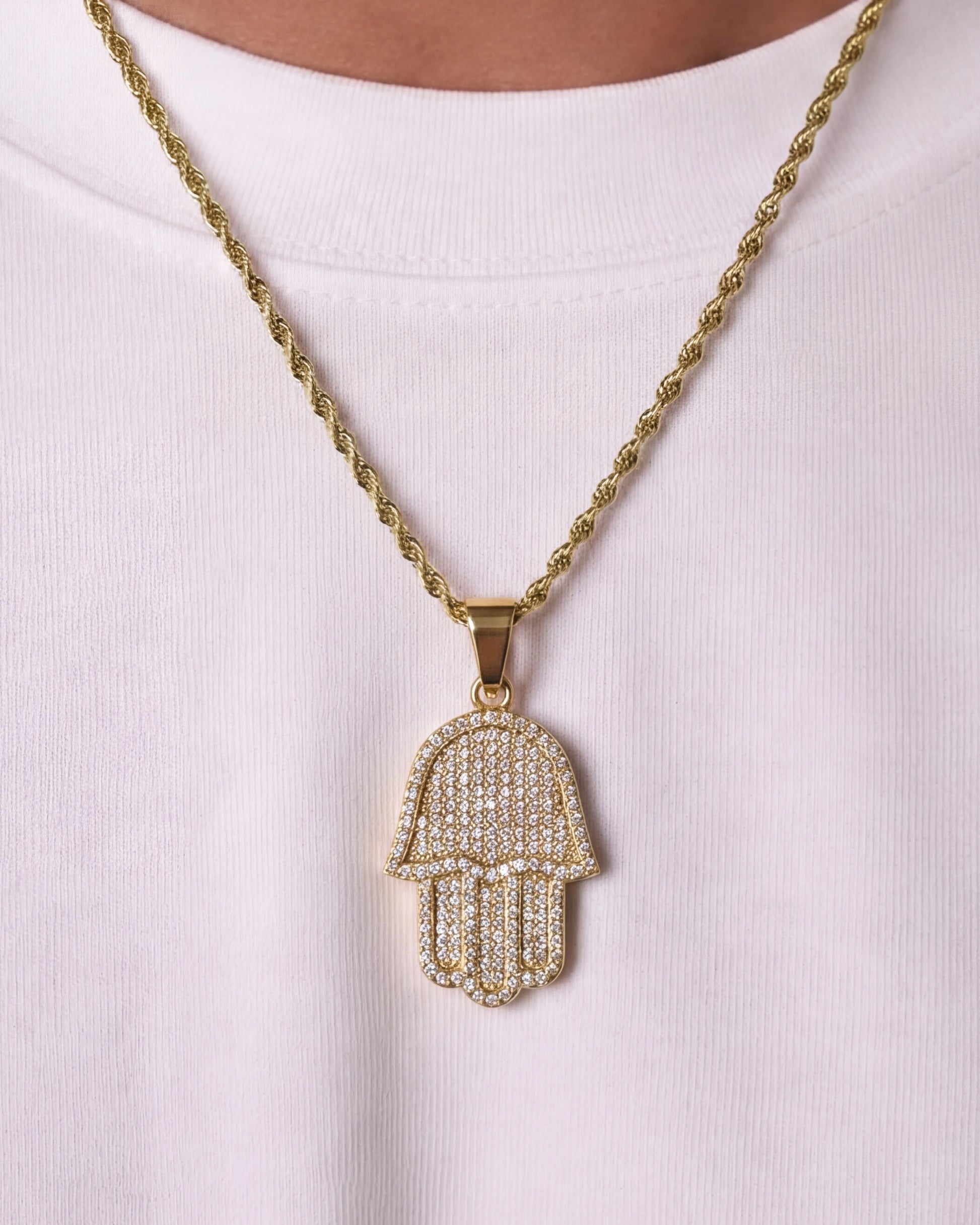 Hamsa hand chain gold on model close up photo