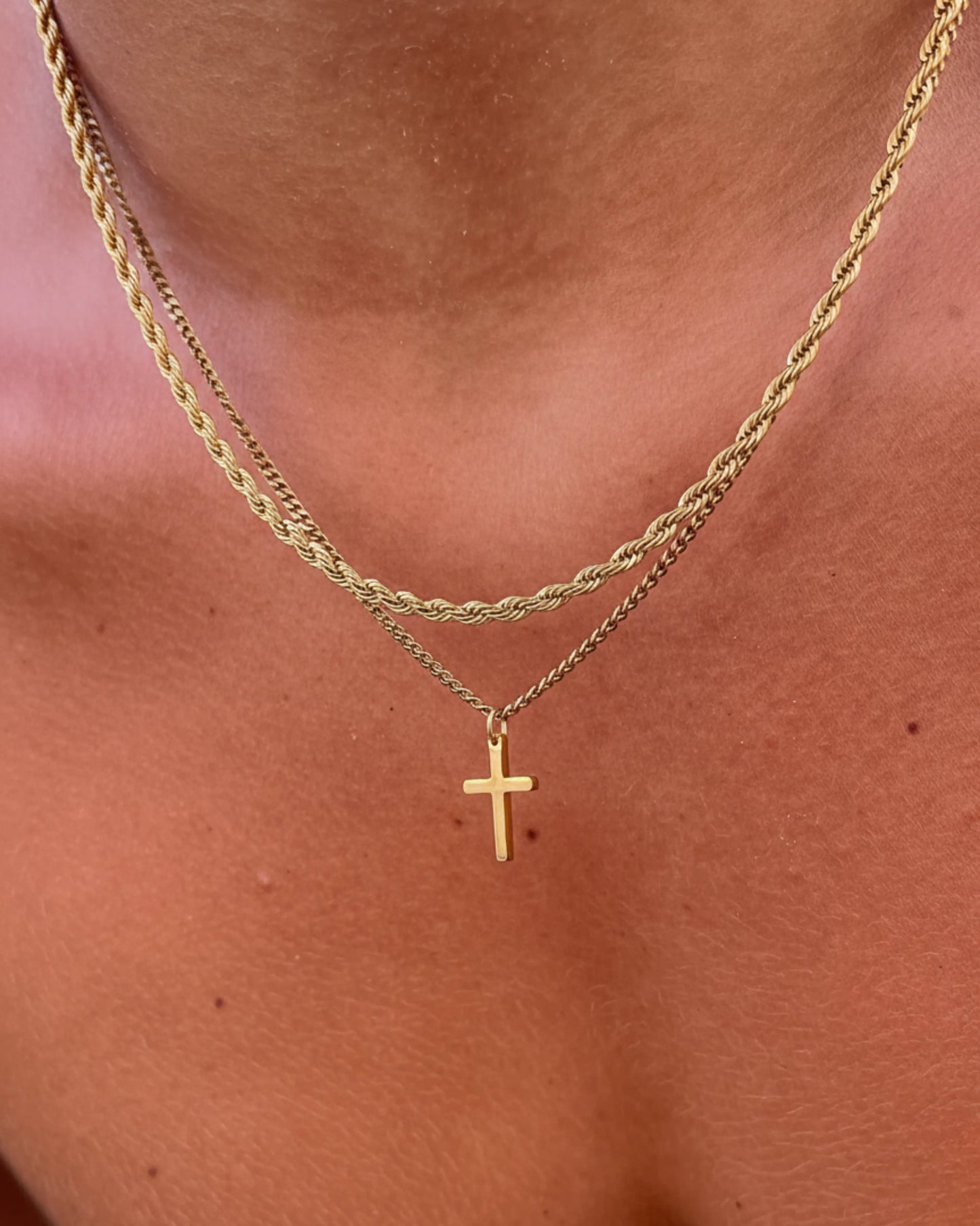 Gold cross chain on model image